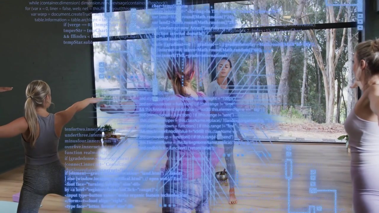 Central yogi holding warrior pose in yoga studio teacher cueing holo code overlay showing alignment