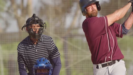 baseball player hitting a ball during a match