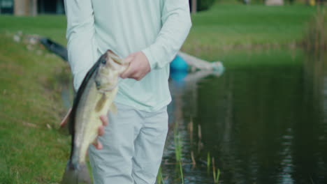 man holding a largemouth bass