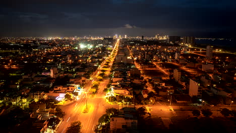 night aerial hyperlapse over illuminated trans-vietnam highway through da nang