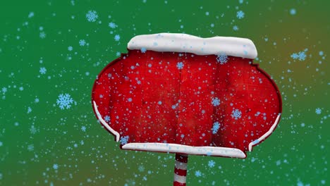 Animación-De-Copos-De-Nieve-Azules-Cayendo-Sobre-Un-Letrero-Rojo-Con-Espacio-De-Copia-Sobre-Fondo-Verde-Degradado