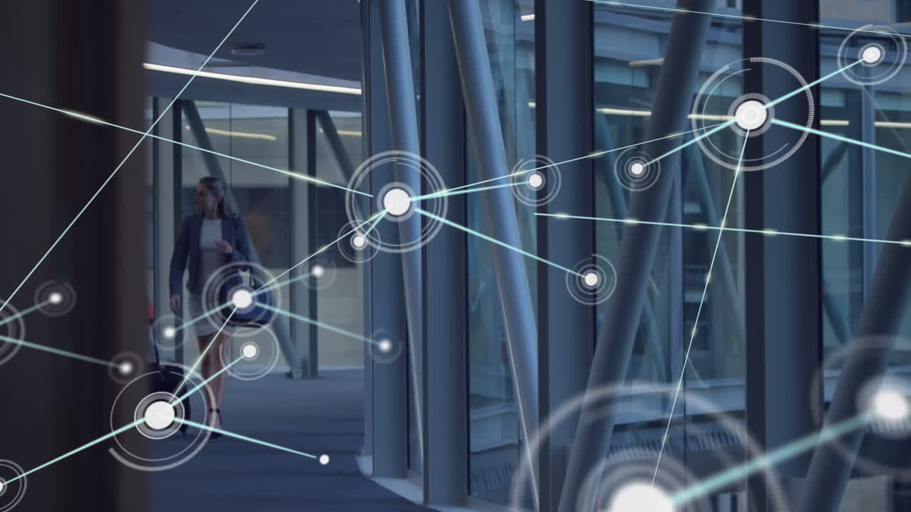Animation of network of connection with icons over diverse businesswoman in office