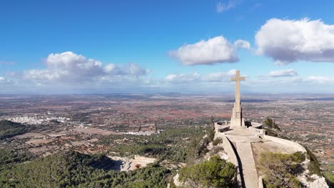 Aerial-Approaching-Shot-Of-Famous-Stony-Cross-Cruz-Desde-Pájaro-Carpintero-Donde-Monte-De-San-Salvador,-Mallorca