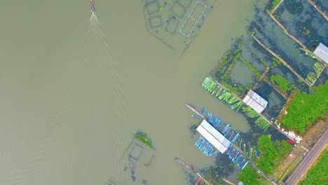 overhead drone view of fish cage on the rawa pening lake, semarang, indonesia