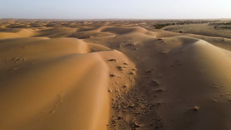 Sand-Dune-Landscape-in-Mauritania-Sahara-Desert,-Africa---Aerial-Wide-Flight