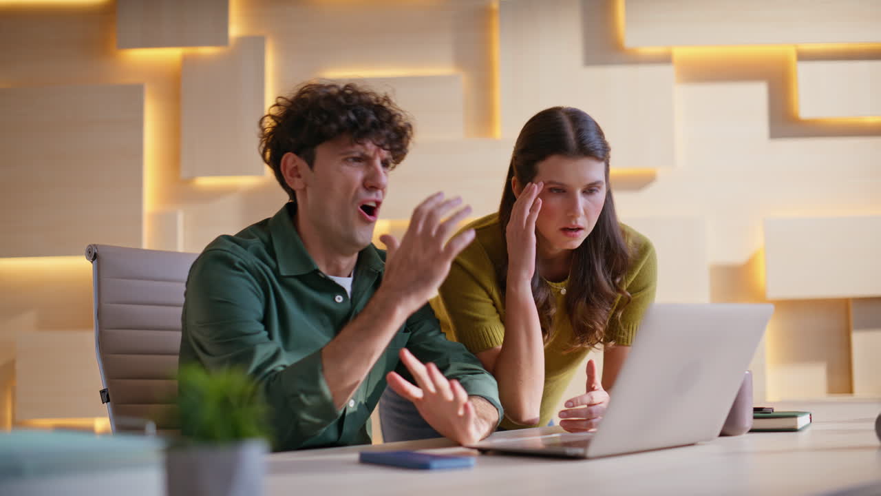 Two colleagues working together in an office