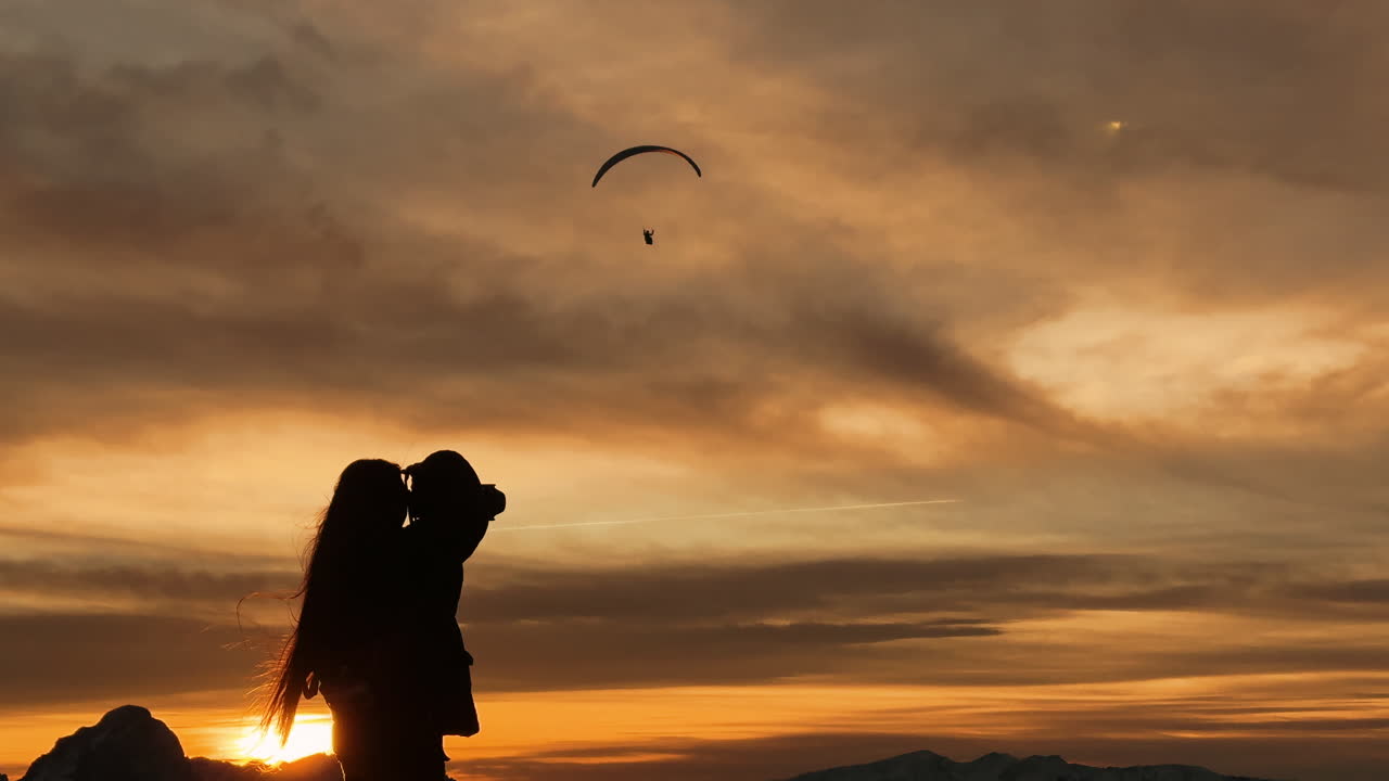 Sunset Paragliding Over the Alps