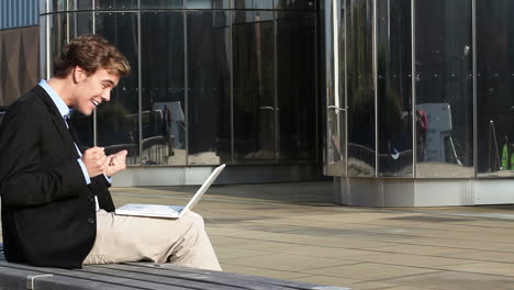 happy businessman using laptop