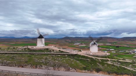historic don quixote windmills in rural consuegra landscape