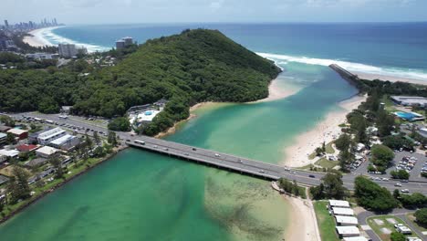 aerial view over tallebudgera creek bridge in gold coast, queensland, australia - drone shot