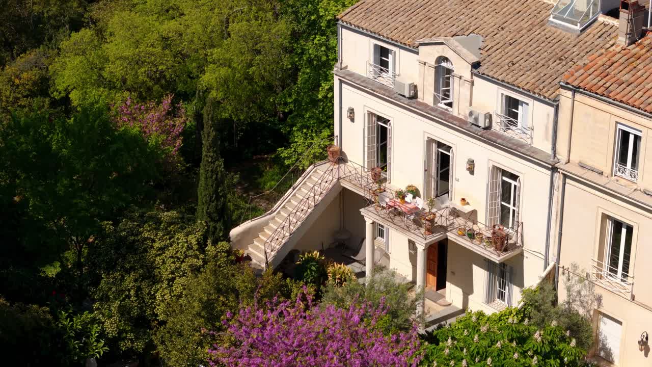 Aerial establishing shot of a luxury villa with a balcony in Montpellier