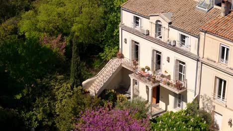 aerial establishing shot of a luxury villa with a balcony in montpellier