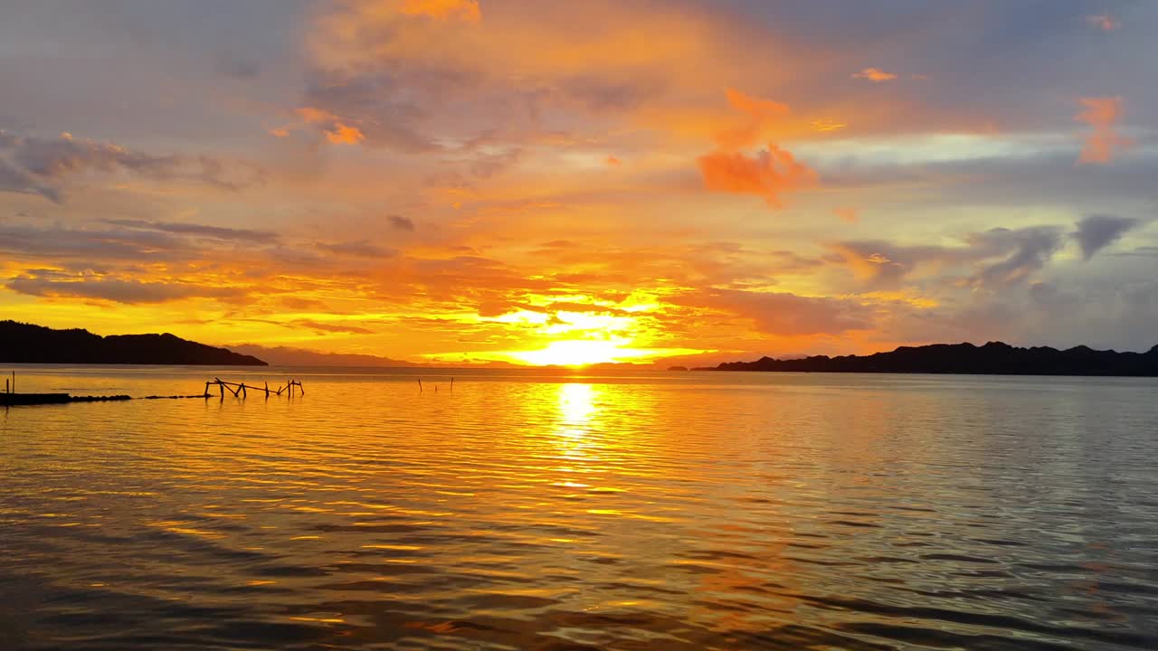 Tropical sunset over relaxing calm waters. Vacation and relaxation vibes