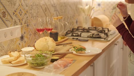 loving couple making a sandwich in kitchen-living room