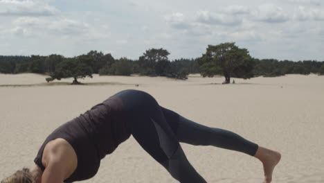 Beautiful-woman-raising-right-leg-while-doing-yoga-exercises