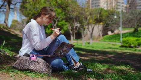 young woman studying in a park