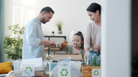 family recycling together