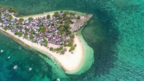 high aerial drone view of inhabited green sand spit of palawan island in the philippines