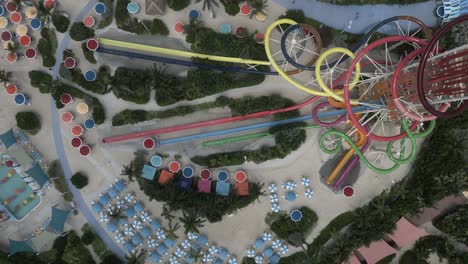 aerial ascends above waterslide tower at waterpark in the bahamas