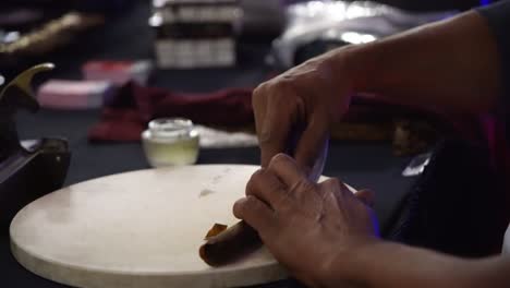 hand rolling a cigar at event