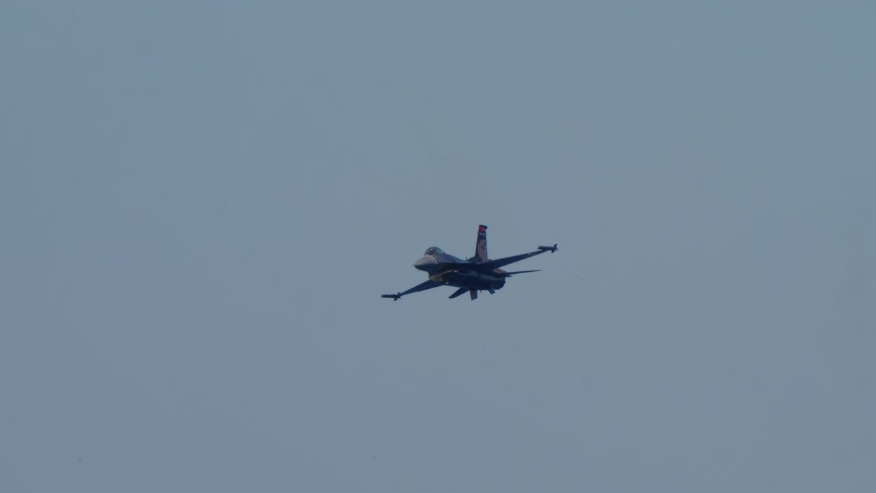 F-16 Fighter Jet Flying in Clear Blue Sky