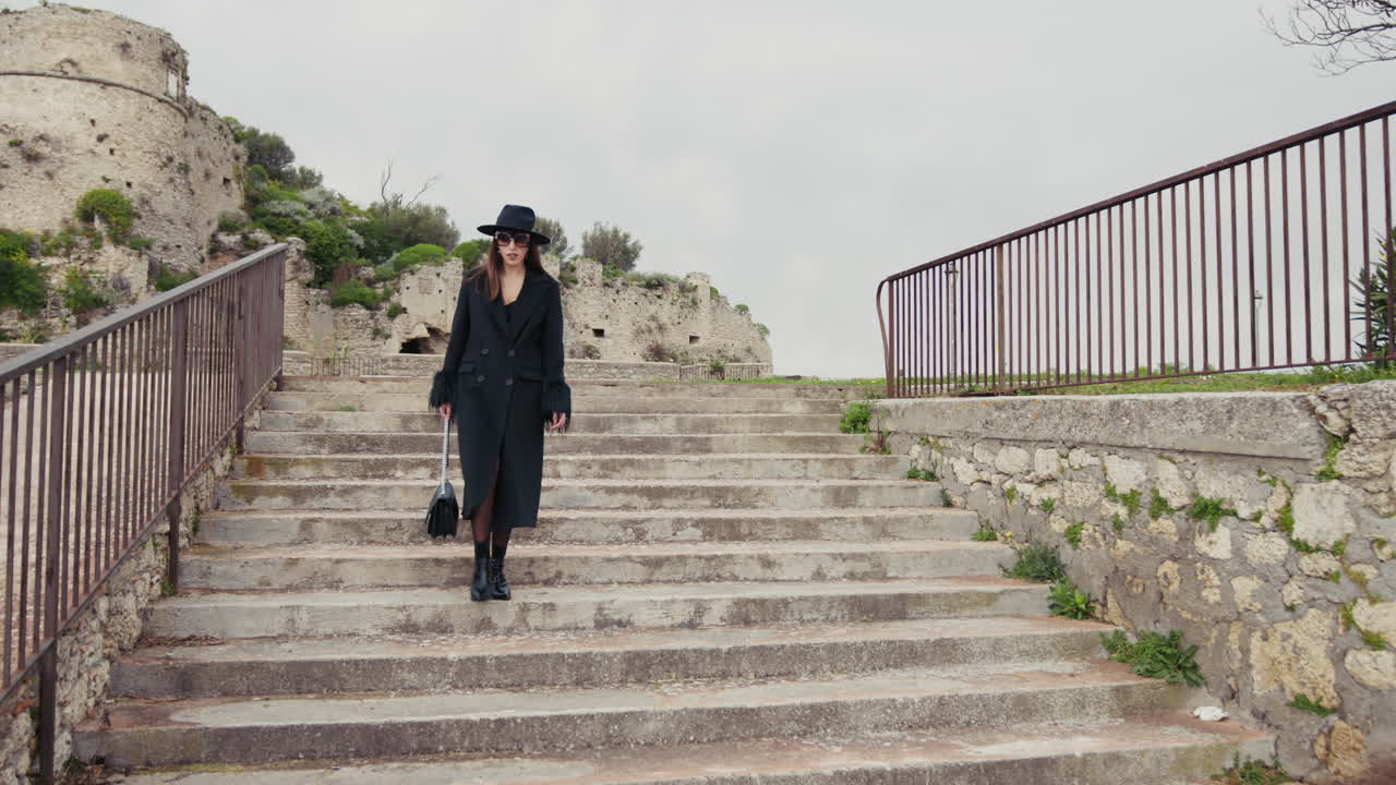 Elegant Woman On High Heels Walking Down The Stairs Of The Town Square