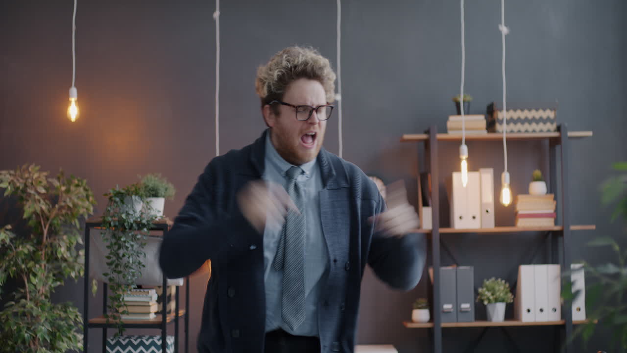 Man Expressing Strong Emotions in an Office