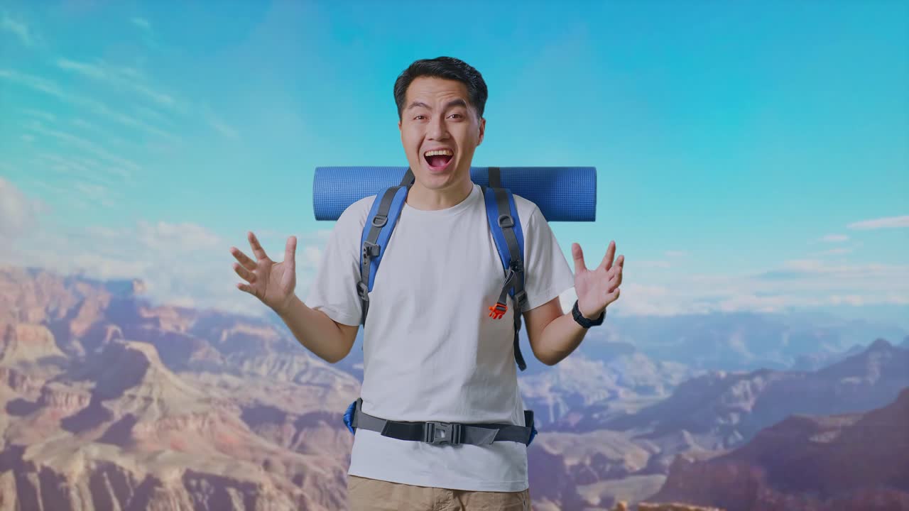 Asian Male Hiker With Mountaineering Backpack Saying Wow While Traveling At The Top Of Mountain