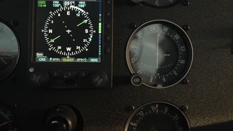 close up airplane navigation instruments - digital hsi during turn