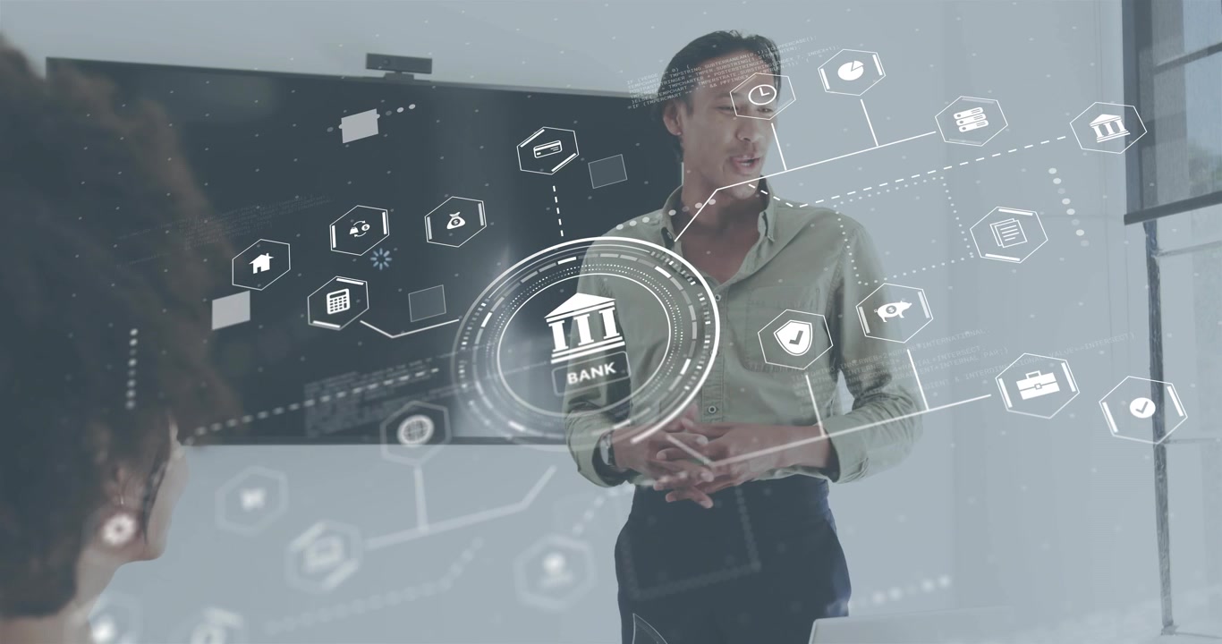 Male host speaking causing finance icons appearing, passing tablet to colleague examining data