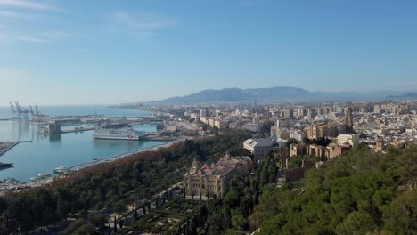 panoramic overview of malaga spain coastline, homes, and cityscape