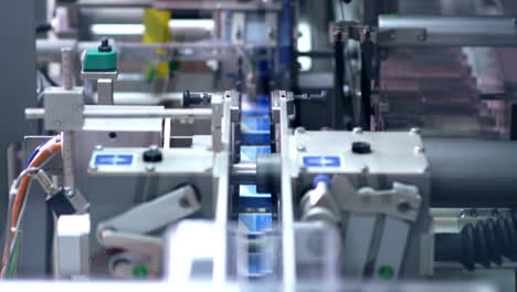 Packaging-line-at-pharmaceutical-factory.-Medical-drugs-on-packaging-machine