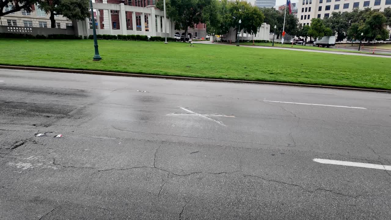 X pianted on street to mark the location of 2nd killing shot in Kennedy assassination