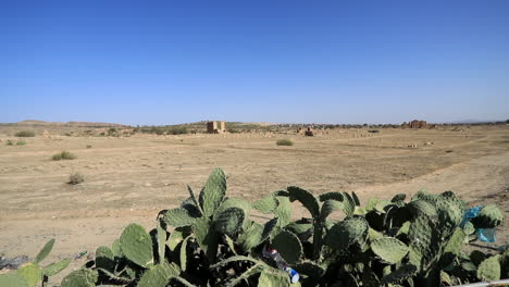 distant view of roman ruins on desert landscape of sbeitla in tunisia