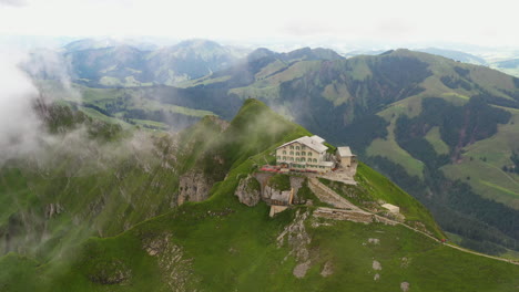 Rotating-drone-shot-of-Berggasthaus-Schäfler-in-Switzerland