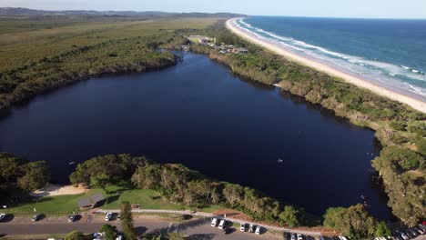 idyllic scenery of lake ainsworth and lennox head beach, lennox head, nsw, australia - drone shot