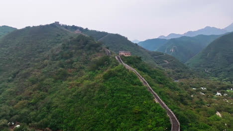 aerial view following the great wall uphill, dark, cloudy day in north china