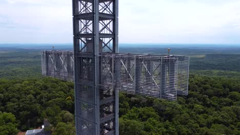 Drone-shot-Argentina-Santa-Ana-forest-with-mast-cross-midday-afternoon-with-blue-sky-cloudy-landscape-around-Santa-Ana