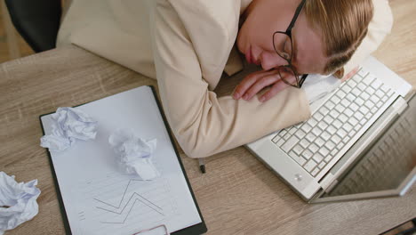 Bored-tired-sleepy-business-woman-falling-asleep-after-routine-work-on-laptop-computer,-office-desk