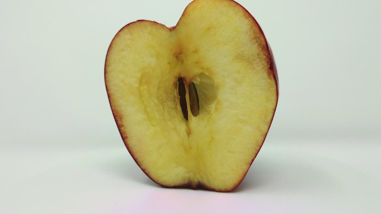 Gala Apple , Cut In Half and rotates round.