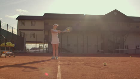 tennis player prepares to serve ball during tennis match