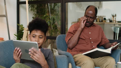 black man and boy in the living room