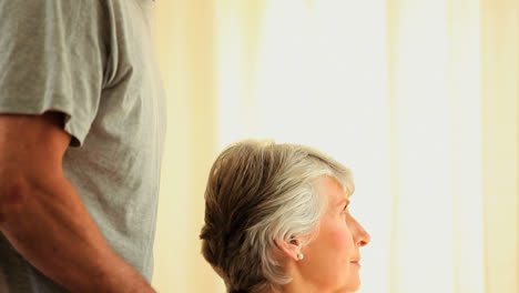 Senior-couple-looking-pensively-outside