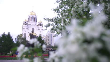 orthodox church and blossoms in a city park