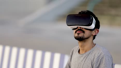 Focused-man-in-VR-headset-on-street