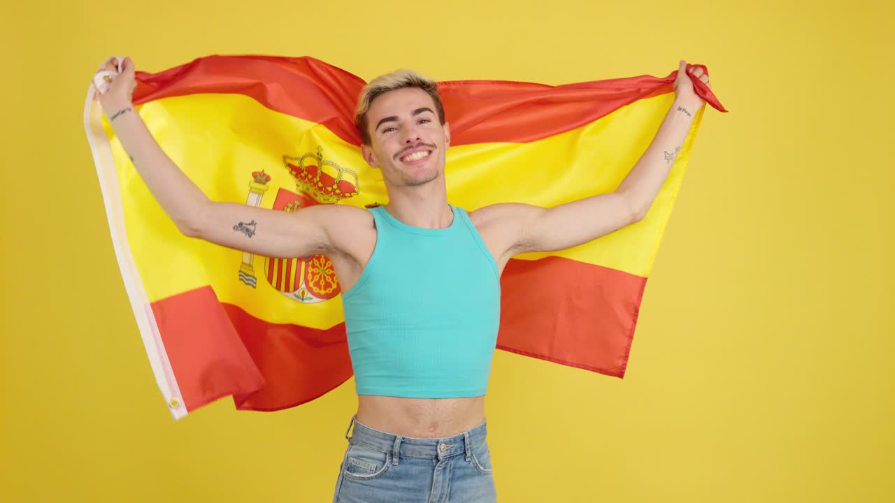 Man posing with Spanish flag