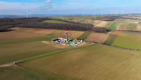 offshore oil well construction site surrounded by rural fields