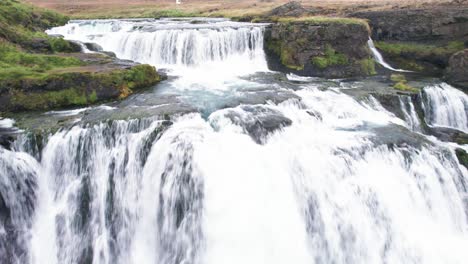 reykjafoss waterfall presents itself as a powerful cascade of water