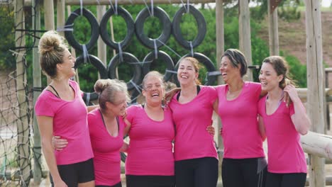 Female-friends-enjoying-exercising-at-boot-camp-together