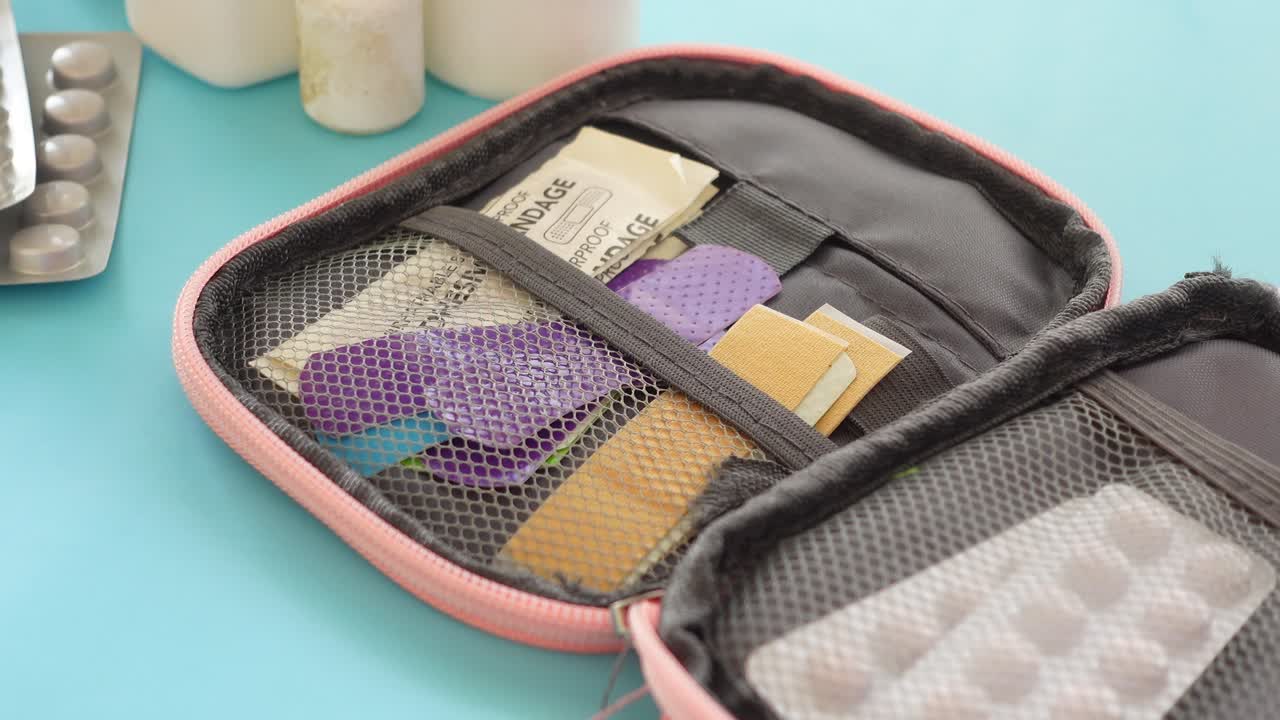 Open First-Aid Kit with Bandages and Pills